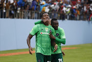 Dove Wome of Orlando Pirates (R) congratulates Thamsanqao Gabuza of Orlando Pirates (L) after scoring a goal during the