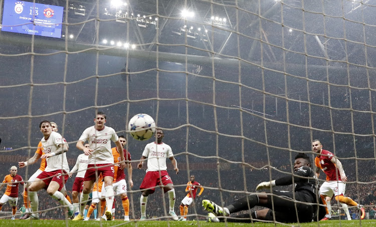 Galatasaray's Hakim Ziyech scores their second goal past Manchester United goalkeeper Andre Onana in the Uefa Champions League Group A match at RAMS Park in Istanbul, Turkey on Wednesday night.