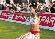 VICTORY RUN:  Mapaseka Makhanya crosses the line to win the Spar Women's Challenge in Durban in June. She is regarded as favourite to win in Pretoria tomorrow  Photo:  Reg Caldecott