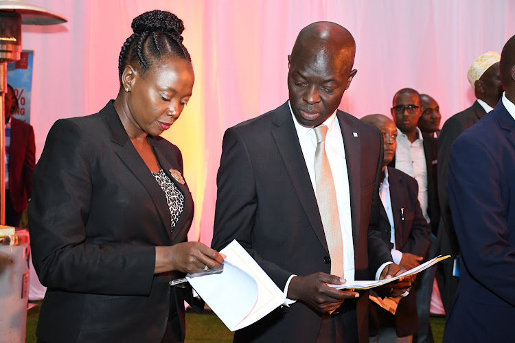 NBK marketing director Bernadette Ngara and her retail banking counterpart Cromwell Kedemi