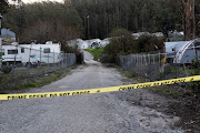 A driveway leading to a farm is taped off, the day after a mass shooting at two locations in the coastal city of Half Moon Bay, California. January 24, 2023.  