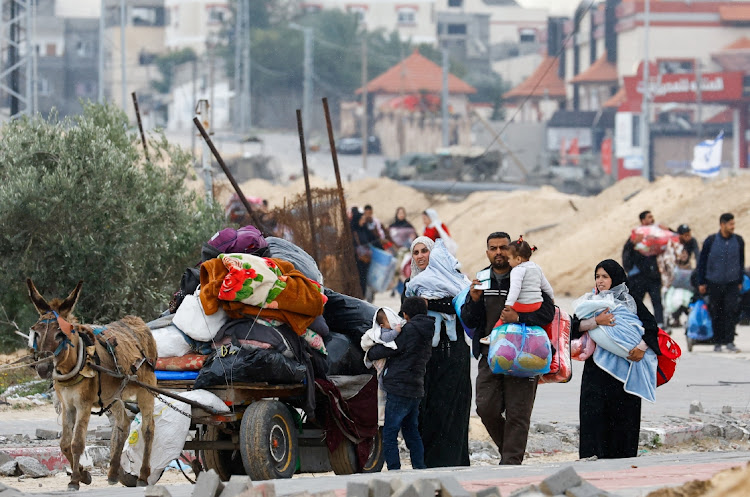 Palestinians fleeing Khan Younis, due to the Israeli ground operation, move towards Rafah, amid the ongoing conflict between Israel and the Palestinian Islamist group Hamas, in the southern Gaza Strip on January 28 2024. Picture: REUTERS/Ibraheem Abu Mustafa