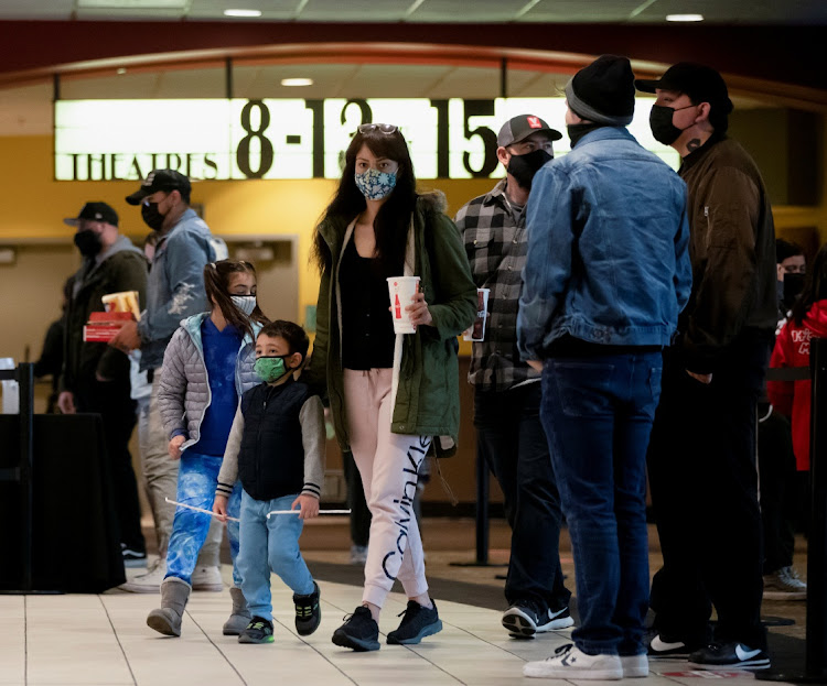 Moviegoers are pictured at a AMC theatre on reopening day during the outbreak of the coronavirus disease (Covid-19), in Burbank, California, US, March 15, 2021.