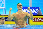 Cameron van der Burgh celebrates winning  the 100m breaststroke final at the world short-course championships in China in 2018. 