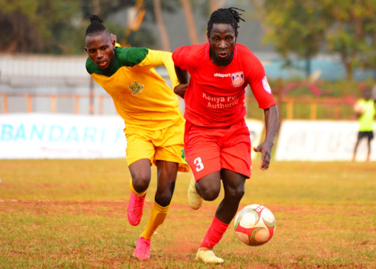 Bandari's Fred Nkata shields the ball from Mathare United's James Kinyanjui in a past KPL match