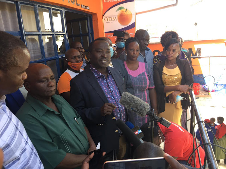 Yatta MP Charles Kilonzo, Machakos ODM branch chairman Peter Mutuku and MCC senatorial by-election candidate John Katuku addressing the press at ODM office in Machakos town on January 28.