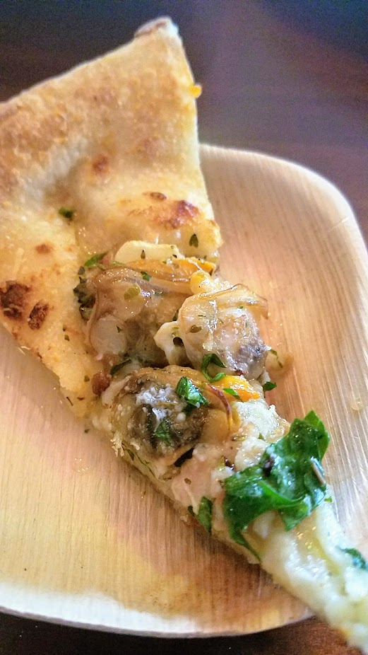 The Crown PDX specialty pizza Put A Clam On It with spicy chorizo, clams, pecorino, oregano, and served with au jus