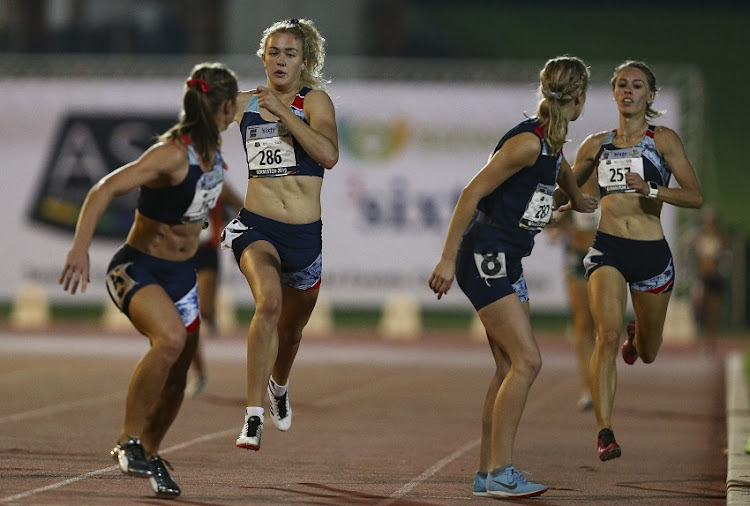 Zeney van der Walt hands the baton to Wenda Nel of AGN in the women's 4x400m relay during Day 3 of the 2019 Sizwe Medical Fund & 3SixtyLife ASA Senior Track & Field and Combined Events Championships at the Germiston Athletics Stadium on April 27, 2019 in Johannesburg, South Africa. (