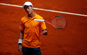 Japanese tennis player Kei Nishikori drops his racket during his match against Spanish player David Ferrer at the ATP Madrid Open in Madrid, on May 11, 2017.