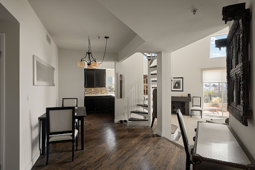 Dining room, kitchen, and spiral staircase - Luxury property for sale in Los Angeles, 2 bedrooms