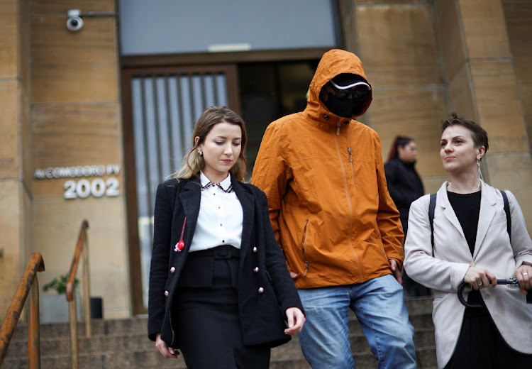 A Ukrainian man who alleges he was tortured by Russian occupying forces walks with Tsvetelina van Benthem, a University of Oxford legal scholar and senior legal adviser at the NGO The Reckoning Project, and Ukrainian journalist co-founder of The Reckoning Project, Nataliya Gumenyuk, outside Comodoro Py Federal Courthouse, before filing a legal complaint to seek accountability for Russian war crimes, in Buenos Aires, Argentina, April 15 2024. Picture: REUTERS/Agustin Marcarian