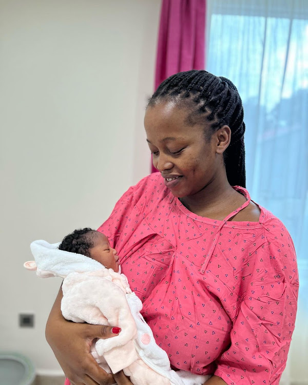 Holding her new born baby Koko Kesia Kiarie