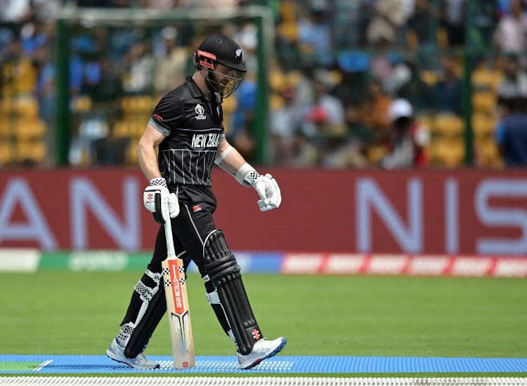 New Zealand's Kane Williamson walks after losing his wicket, caught by Pakistan's Fakhar Zaman off the bowling of Iftikhar Ahmed.