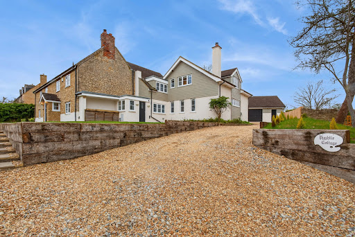 Stone and grey siding house in this luxury house for sale in Towcester ($1,481,511)