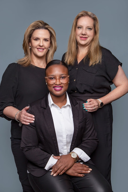 CEO of Unleashed Combat Gugu Tshabalala is flanked from right by owner Shereen Hunter and Condace Jacob.