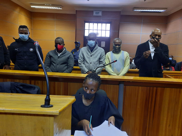 Thabo Leshabane (extreme right) clad in a black jacket and white shirt together with four other men stand accused of killing Makoena Leshabane (his wife) and her friend, Tebogo 'Ted' Mphuthi.