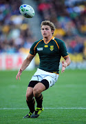 FILE IMAGE: Pat Lambie eyes the ball during quarter final three of the 2011 IRB Rugby World Cup between South Africa and Australia at Wellington Regional Stadium on October 9, 2011 in Wellington, New Zealand