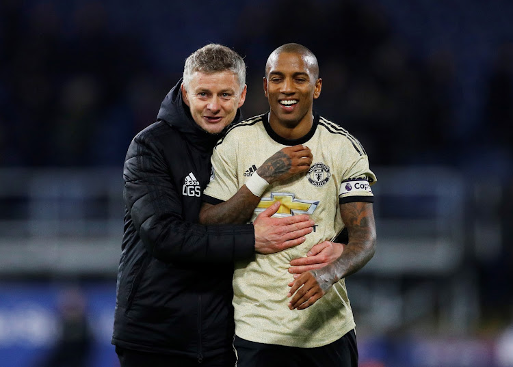 Manchester United captain Ashley Young with his manager Ole Gunnar Solskjaer during a recent match