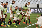 Springboks busy with warmups during the Castle Lager Lions Series 1st Test match between South Africa and British and Irish Lions at Cape Town Stadium on July 24, 2021 in Cape Town, South Africa. 
