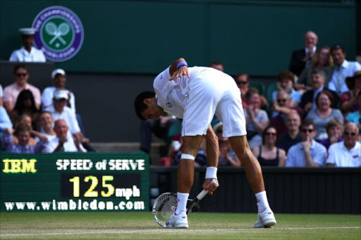 Novak Djokovic of Serbia smashes his racket during his third round match against Marcos Baghdatis of Cyprus on Day Six of the Wimbledon Lawn Tennis Championships at the All England Lawn Tennis and Croquet Club on June 25, 2011 in London, England