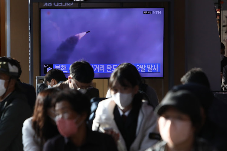 People watch a television broadcast showing a file image of a North Korean missile launch at the Seoul Railway Station on October 28, 2022 in Seoul, South Korea. North Korea fired two short-range ballistic missiles (SRBMs) toward the East Sea on Friday, the South Korean military said, as Seoul's major military exercise drew to a close.
