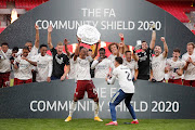 Pierre-Emerick Aubameyang of Arsenal lifts the Community Shield Trophy following his team's victory in during the FA Community Shield final between Arsenal and Liverpool at Wembley Stadium on August 29, 2020 in London, England. 