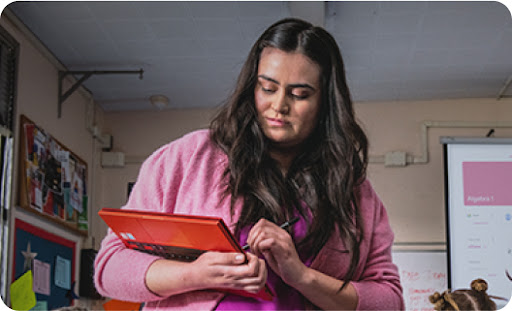 Teacher takes attendance on red chromebook with stylus