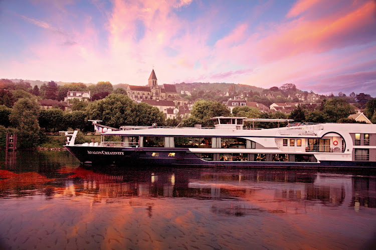 Avalon Creativity on the River Seine in France at dusk. 