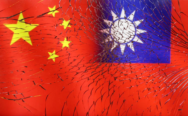 FILE PHOTO: Chinese and Taiwanese flags are seen through broken glass in this illustration taken, April 11, 2023. REUTERS/Dado Ruvic/Illustration/File Photo