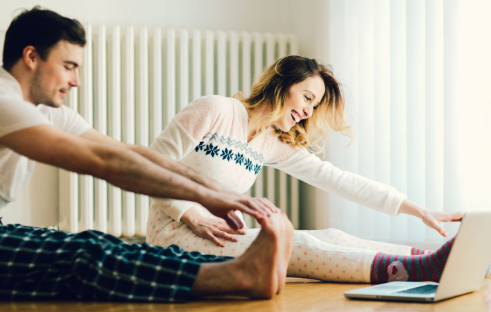 A man and woman sticking to their New Year resolution to exercise 