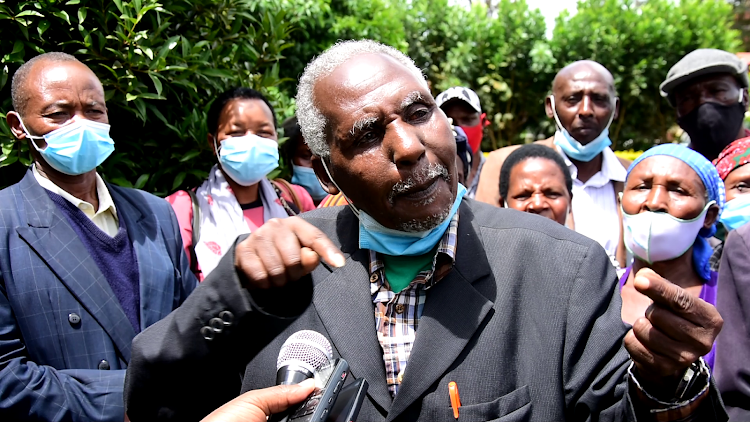 Some of the beneficiaries r the Kandara Residents Association speaking in Thika on Tuesday.