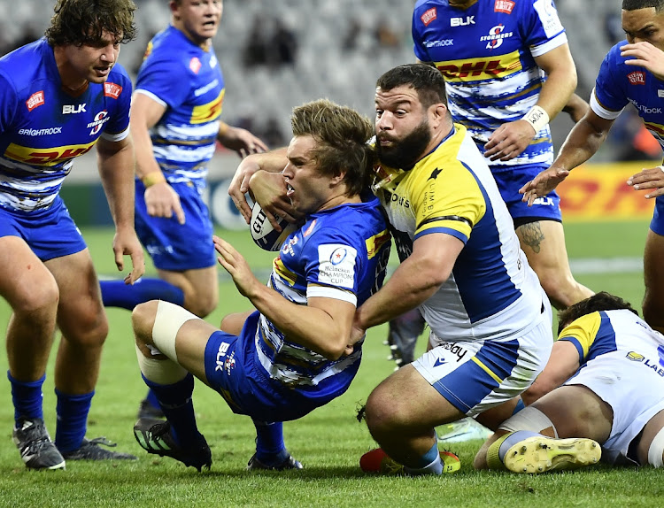 Dan du Plessis of the Stormers is tackled by Rabah Slimani of ASM Clermont Auvergne in a Champions Cup match at Cape Town Stadium.