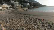 Photo shows what the beach looks like now, with homes overlooking the ocean. 