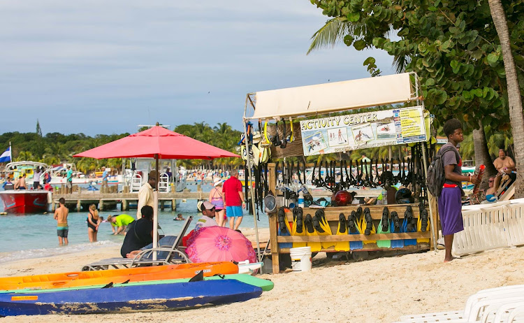 Visitors can choose from a wealth of water activities at West End Beach on Roatan Island, Honduras. 