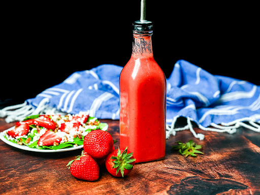 A jar of Pick Your Berry Vinaigrette.