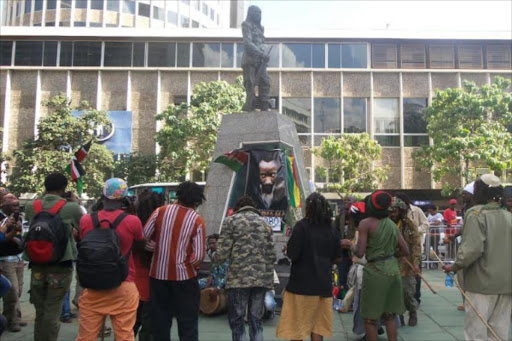 Activists and family members of the late Dedan Kimathi dancing at his monument to commemorate his day.Photo/Collins Kweyu