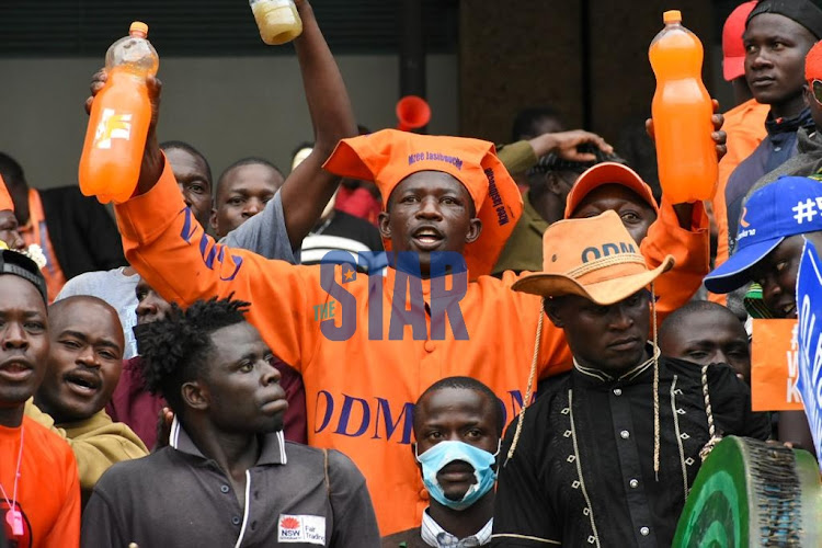 ODM supporters sing at Kasarani Stadium ahead of the Azimio La Umoja launch by ODM leader Raila Odinga on December 10, 2021.