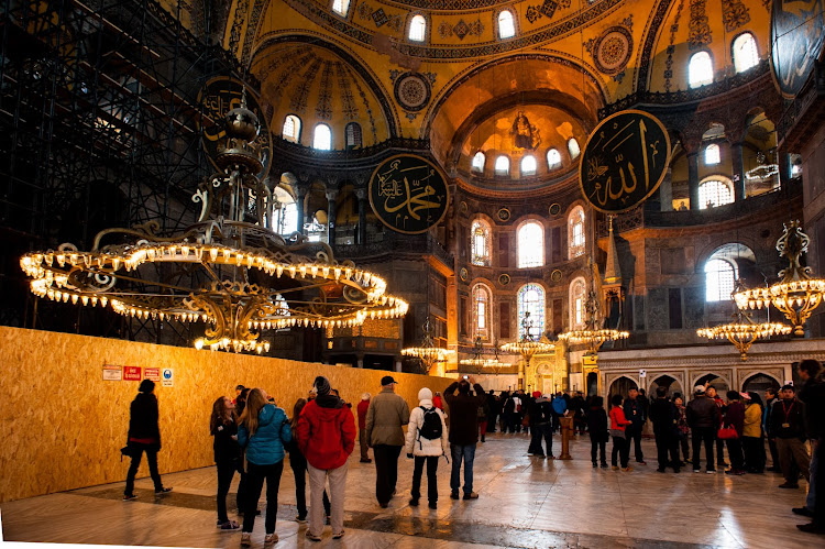 Visitors admire the interiors of the Hagia Sophia in this 2013 file photo.