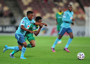 Orlando Pirates' Paseka Mako and Thami Masiya of Baroka FC compete for the ball in the DStv Premiership match at Peter Mokaba Stadium in Polokwane on April 12 2022. Later in the game Mako was involved in a horror clash with his own goalkeeper Richard Ofori and taken off by ambulance.
