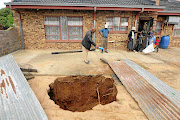 The Ngoako family are living with the danger of a sinkhole in their yard in Ngobi, North West. The sinkhole was discovered by five-year-old Otlotleng  two weeks ago./Thulani Mbele