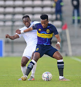 FILE IMAGE: Khanyisa Mayo of Cape Town City is challenged by Onismor Bhasera of Supersport United during the DStv Premiership match between Cape Town City FC and SuperSport United at Athlone Stadium on August 21, 2021 in Cape Town, South Africa. 