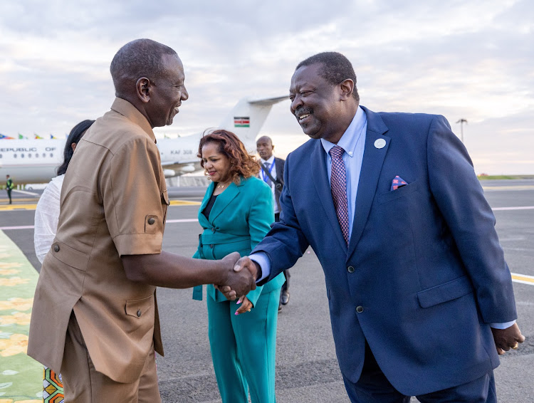 President William Ruto greeting Prime Cabinet Secretary and Cabinet Secretary for Foreign and Diaspora Affairs Musalia Mudavadi when he arrived in Ethiopia to attend the 37th African Union Summit of Heads of State and Government on February 16, 2024.