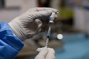 A nurse fills a syringe with a dose of the Pfizer-BioNTech Covid-19 vaccine at the Love Hospital in Seoul, South Korea, on Thursday, August 26, 2021. 