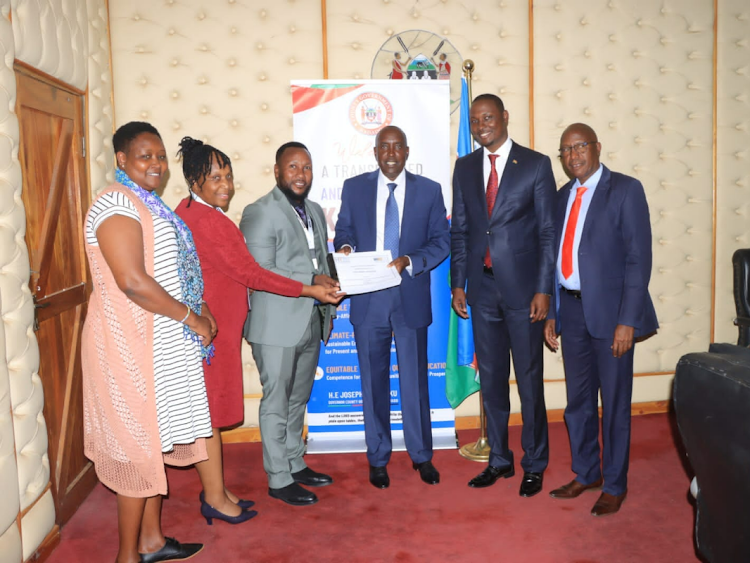 Governor Joseph ole Lenku receives county staff audit report in his office on October 19, 2023.
