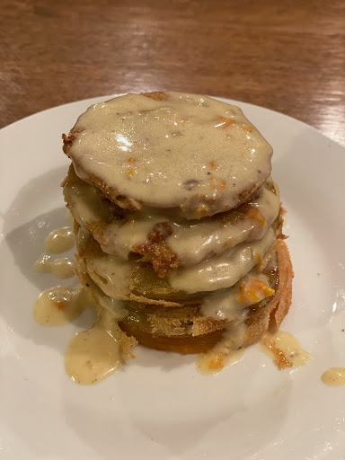 Green tomatoes fried and topped with a pepper cream sauce