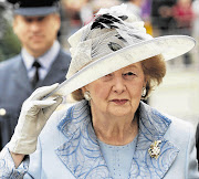 Former British Prime Minister Margaret Thatcher arrives for a service of thanksgiving and re-dedication on Battle of Britain Sunday at Westminster Abbey in London