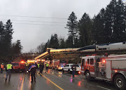 First responders are seen at the scene of an Amtrak passenger train derailment on interstate highway (I-5) in this Washington State Patrol image moved on social media in DuPont, Washington, US, December 18, 2017. 