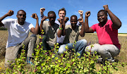 Community members of Chic Shanty Town planting spekboom trees for a sustainable income.