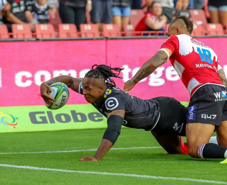 Sbu Nkosi of the Cell C Sharks scores a try against the Lions. Nkosi is one of the six uncapped players named in Springboks head coach Rassie Erasmus's Bok camp.