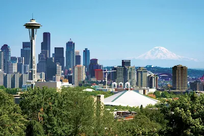 See Seattle, with Mt. Rainier looming in the distance, on a vacation to the Pacific Northwest with American Cruise Lines.
